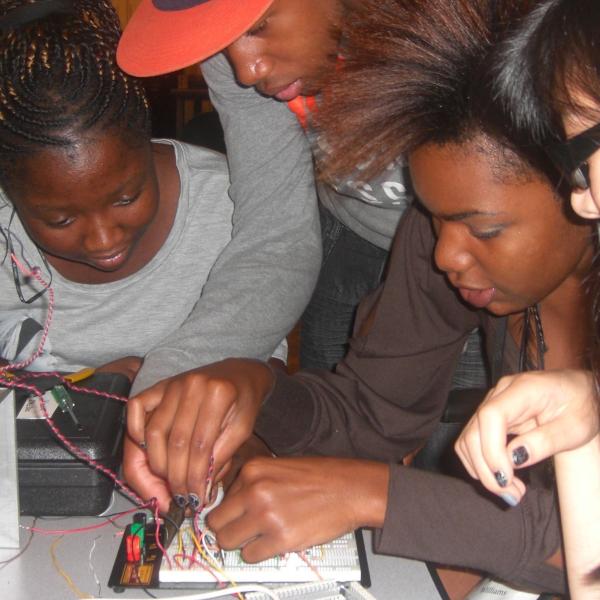 Four students doing a hands on electronics project